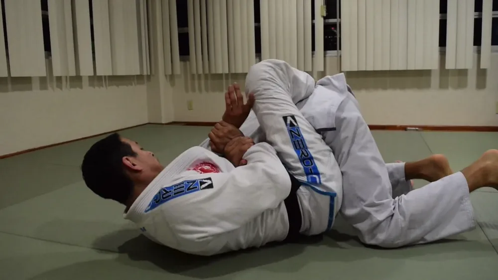 Athlete finishing a kimura